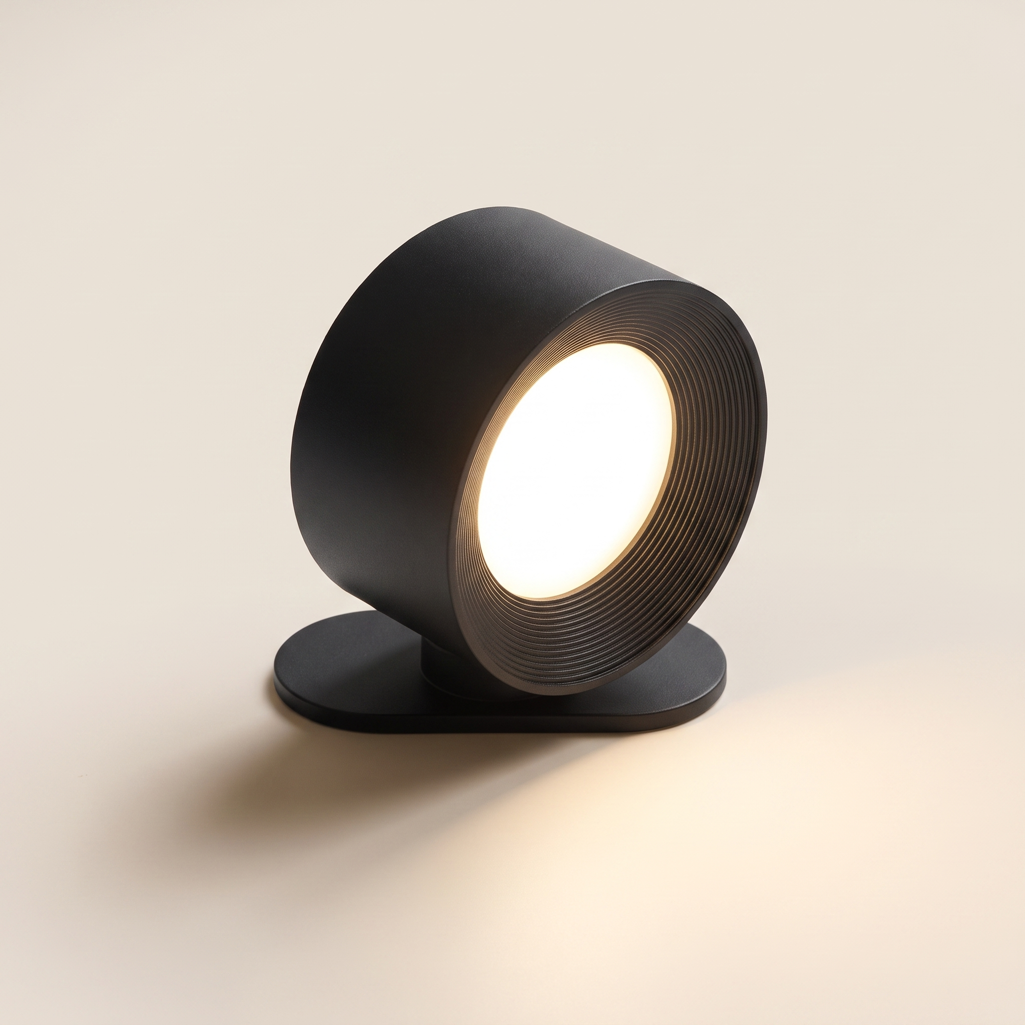 Cordless wall lamp seen from the front with its magnetic base